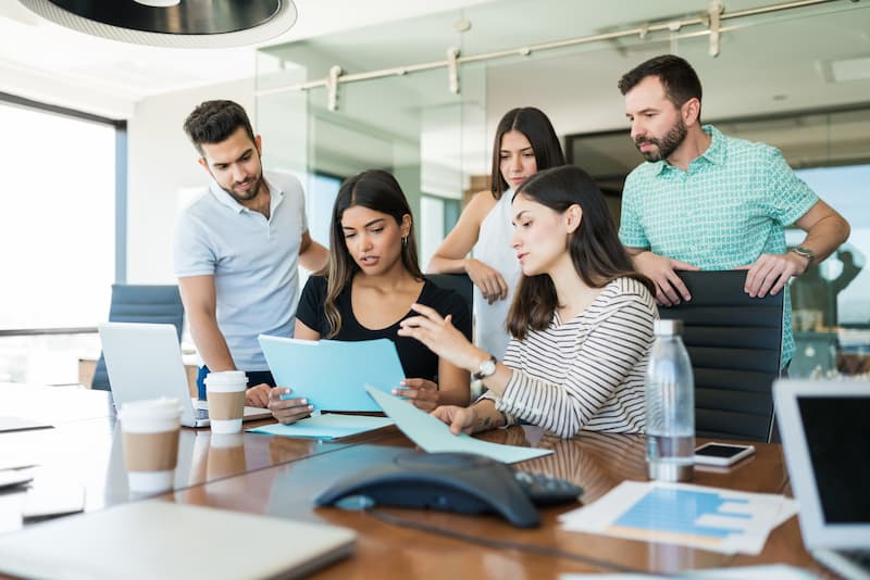 Team Business Professionals Discussing File Desk Creative Office Meeting (1)