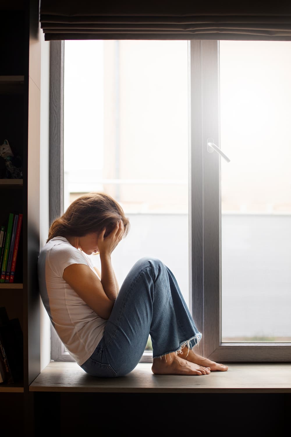 Portrait Young Woman With Low Self Esteem Sitting By Window Home (1)
